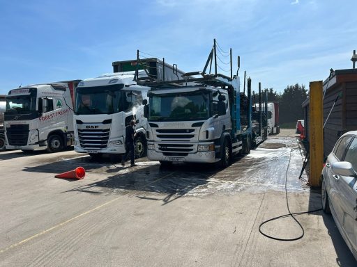 Commercial vehicles lined up at Welford Truck Wash